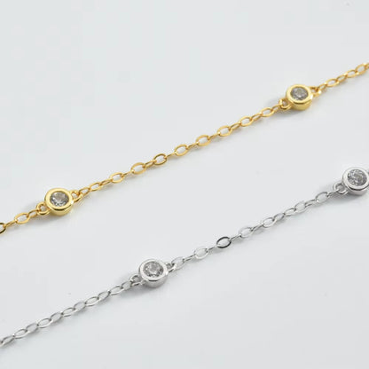 Gold and silver cubic zirconia bezel link bracelets with round sparkling stones