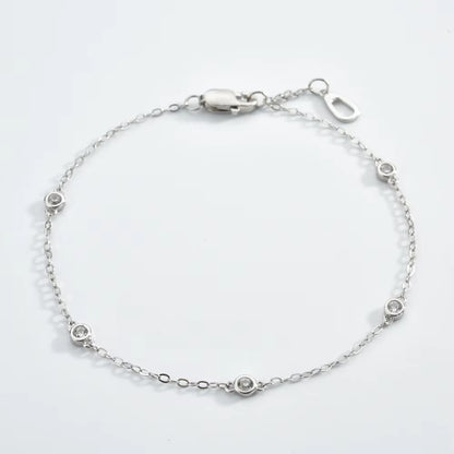 Silver cubic zirconia bezel link bracelet with round stones and lobster clasp