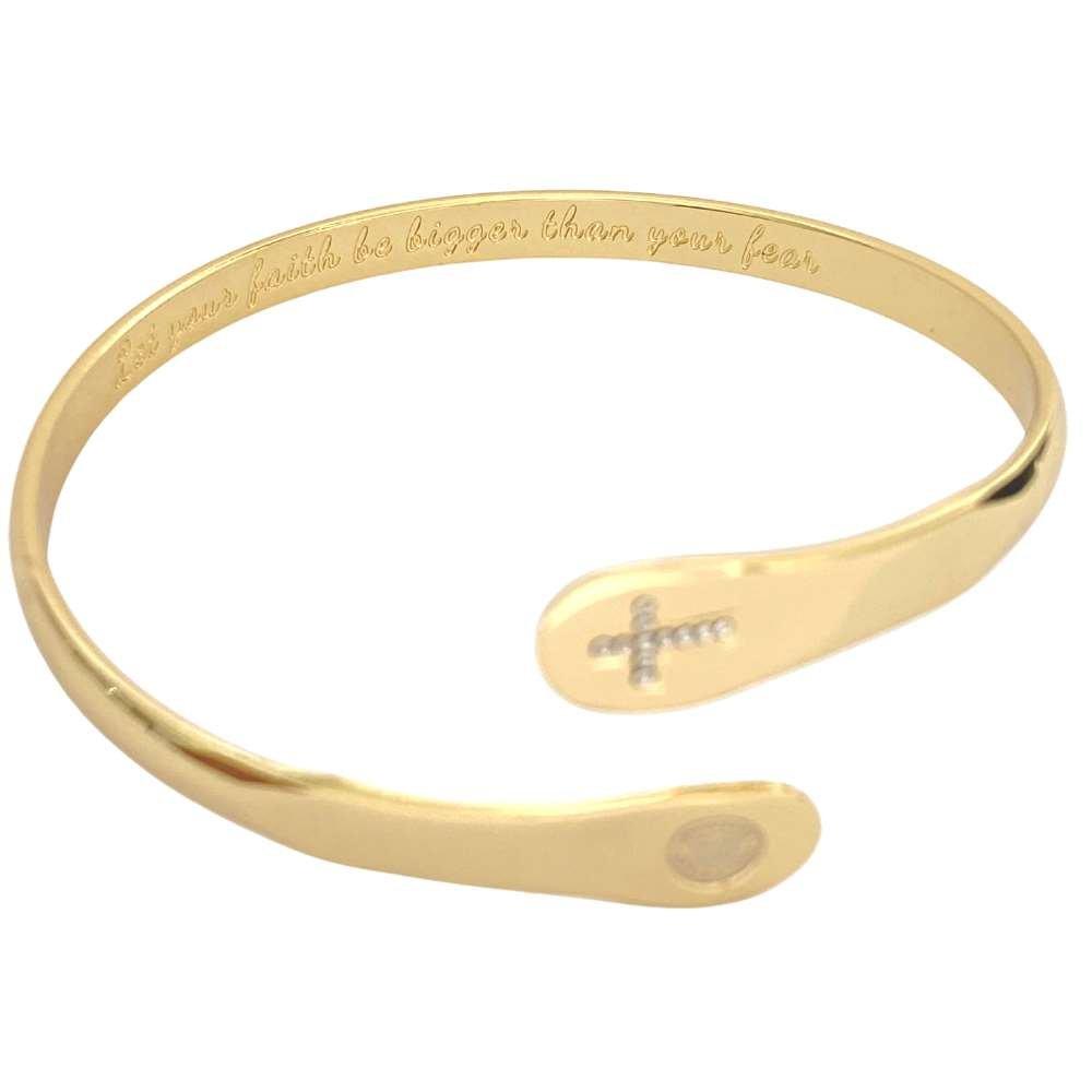 Gold cross faith bracelet cuff with engraved text along the band and small cross charm