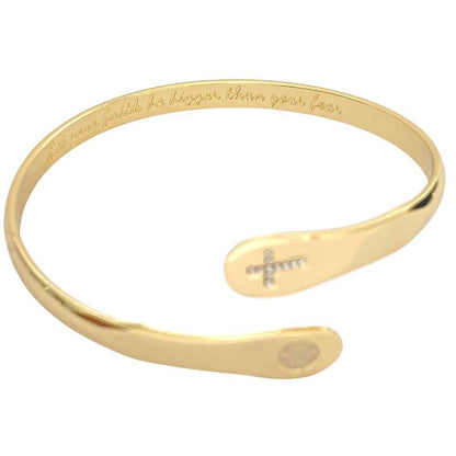 Gold cross faith bracelet cuff with engraved text along the band and small cross charm
