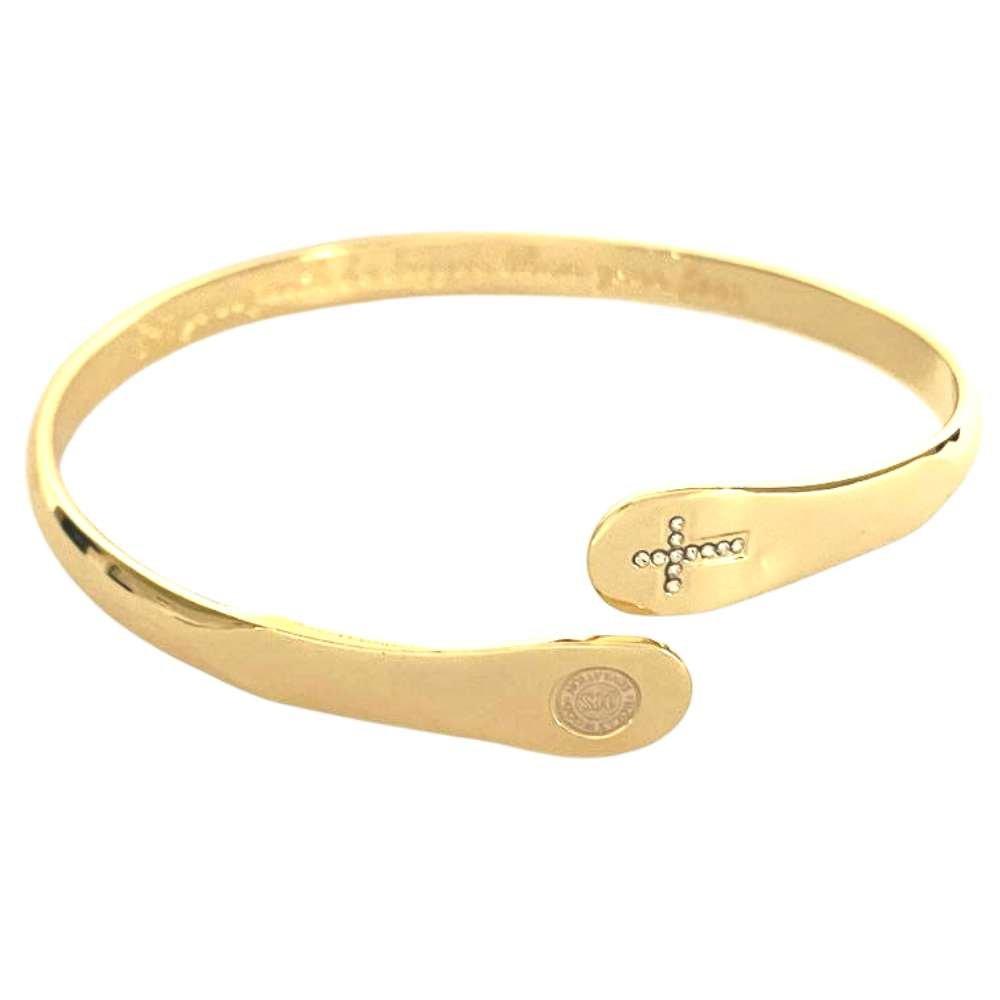 Gold cross faith bracelet cuff with circular emblem and engraved band detail