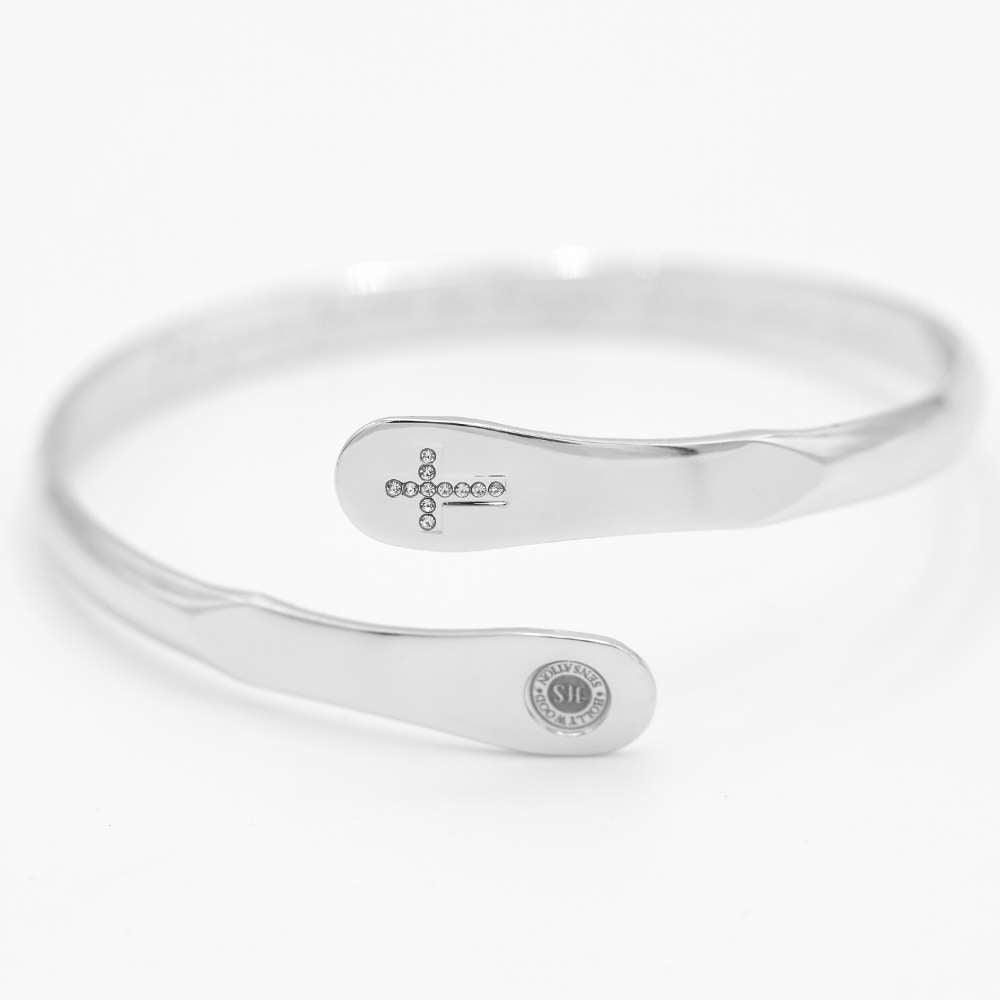 Silver cross bracelet with crystal cross motif on flat oval centerpiece