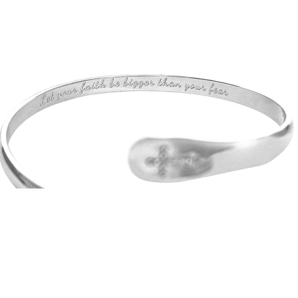Silver cross bracelet with engraved faith message around the inner band