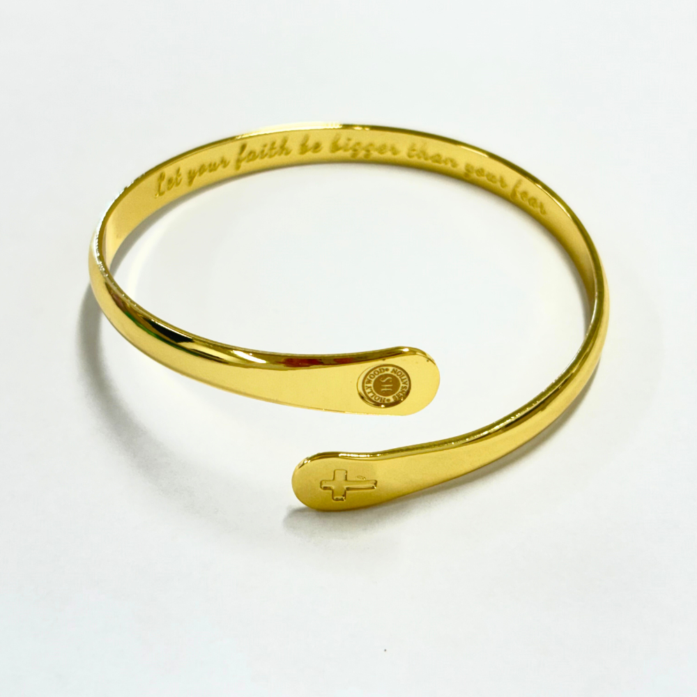 Gold cross cuff bracelet with engraved faith quote, round medallion center, open end