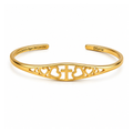 Gold faith bracelet with cross and heart cutout engraving, adjustable cuff bangle