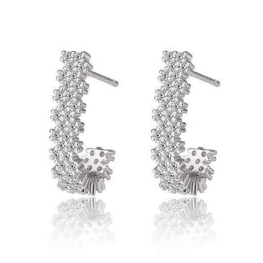 Silver-tone J hoop earrings with clear cubic zirconia stones and dangling charm