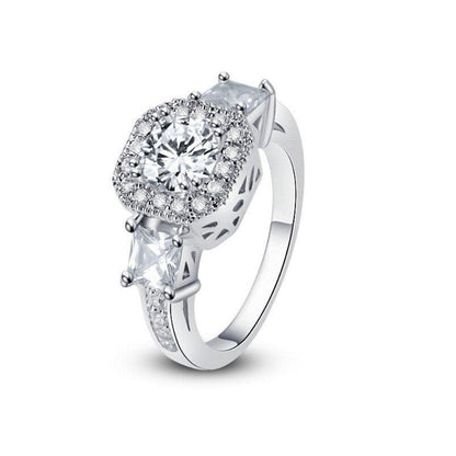 Cubic zirconia halo ring with large round center stone on slim silver band
