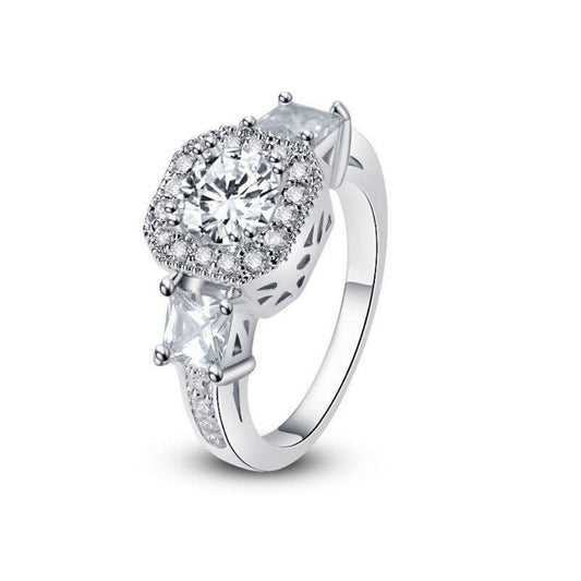 Cubic zirconia halo ring with large round center stone on slim silver band