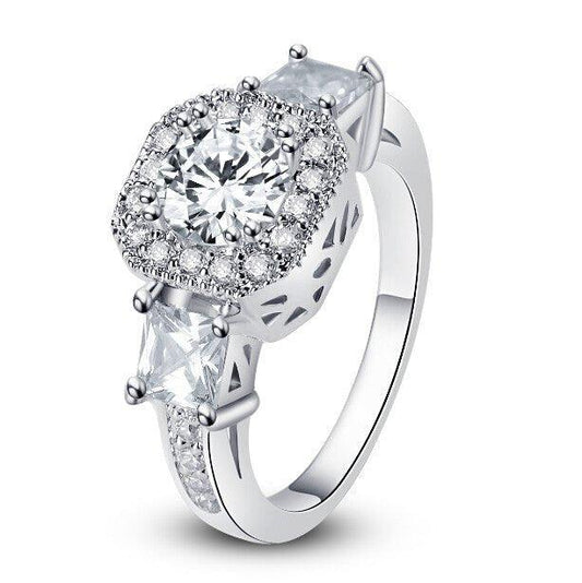 Cubic zirconia halo engagement ring with raised round center stone, openwork sides
