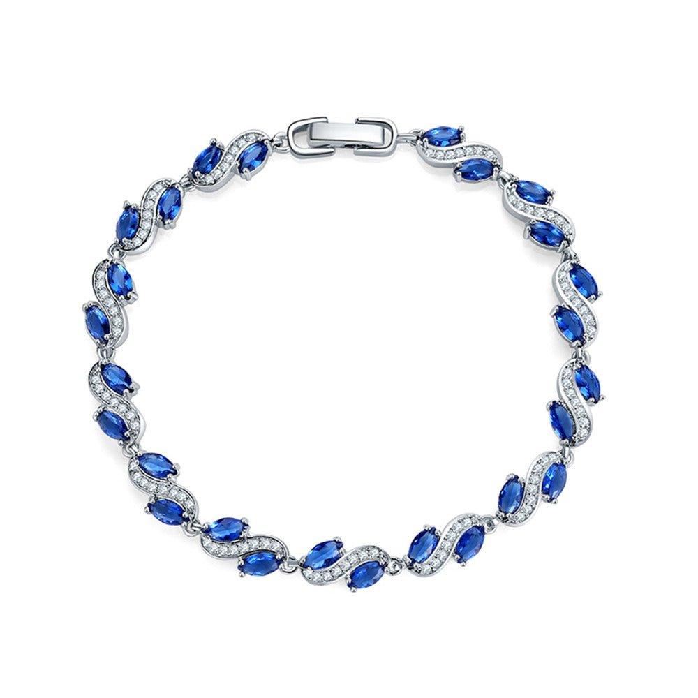 Cubic zirconia tennis bracelet with blue oval stones and silver-tone clasp