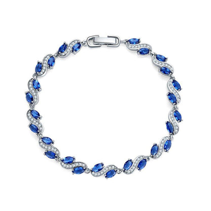 Cubic zirconia tennis bracelet with blue oval stones and silver-tone clasp