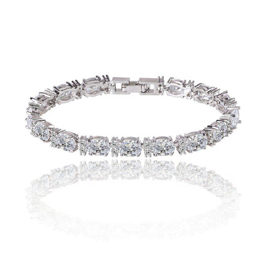 Silver-tone tennis bracelet with oval and round cubic zirconia stones, clasp detail