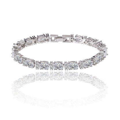 Silver-tone tennis bracelet with oval and round cubic zirconia stones, clasp detail