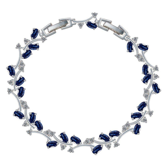 Sapphire blue tennis bracelet with oval CZ stones and silver-tone link frame