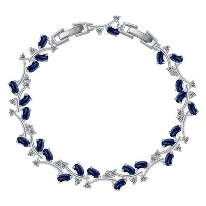 Sapphire blue tennis bracelet with oval CZ stones and silver-tone link frame