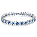 Marquise-cut blue and clear tennis bracelet with silver-toned links and hinged clasp