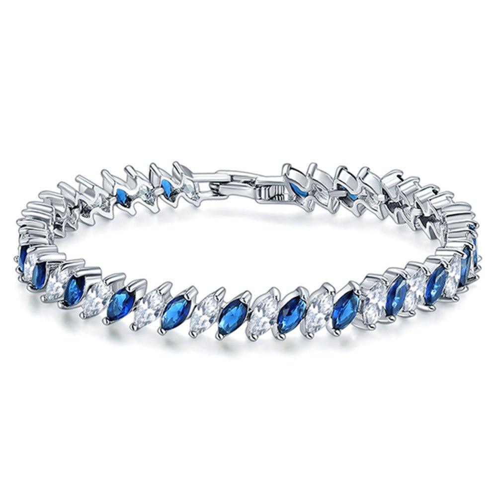 Marquise-cut blue and clear tennis bracelet with silver-toned links and hinged clasp