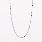 Silver link necklace with black bead stations and delicate chain links