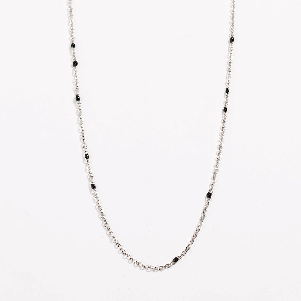 Silver link necklace with black bead stations and delicate chain links