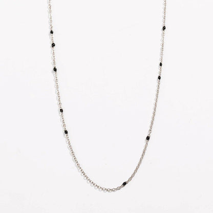 Silver link necklace with black bead stations and delicate chain links