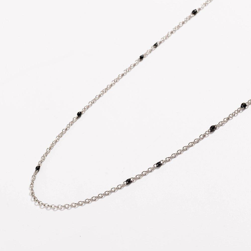 Gold-tone beaded link necklace with small black onyx-style beads, U-shape.