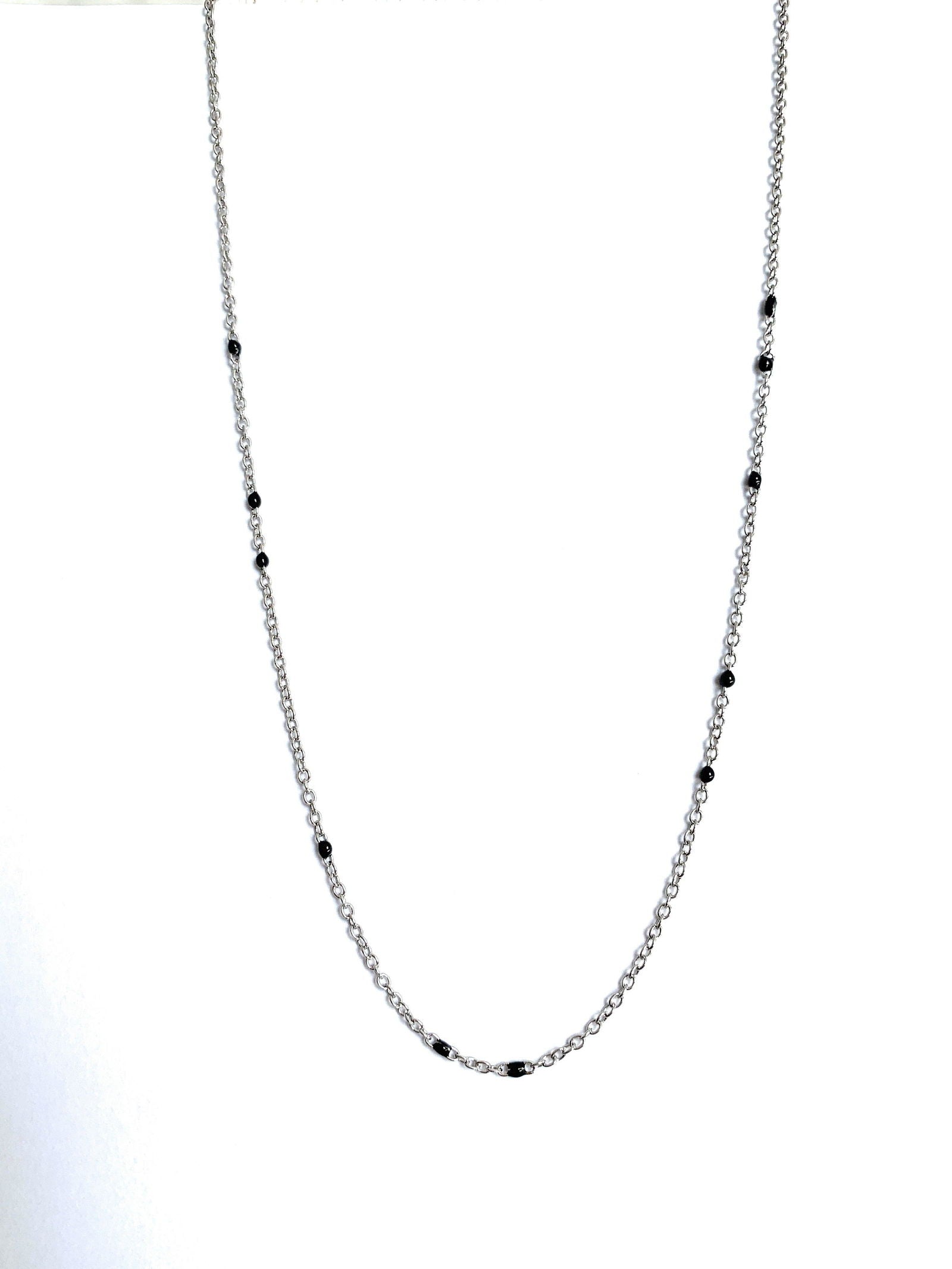 Silver-tone beaded link necklace with black onyx-style beads, centered close-up.