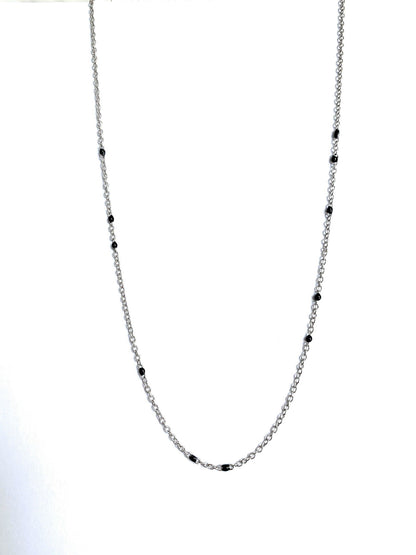 Silver-tone beaded link necklace with black onyx-style beads, centered close-up.