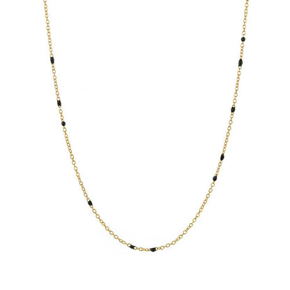 Gold link necklace with small black bead accents along the chain