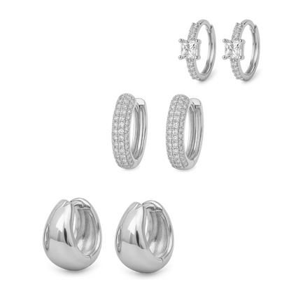 Silver-tone huggie hoop earrings with crystal cross detail