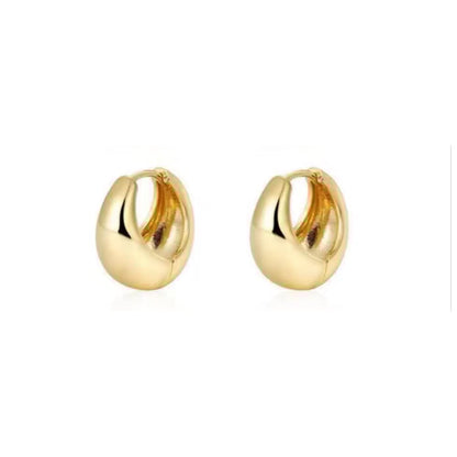 Gold huggie hoop earrings with smooth polished finish, shown as a pair