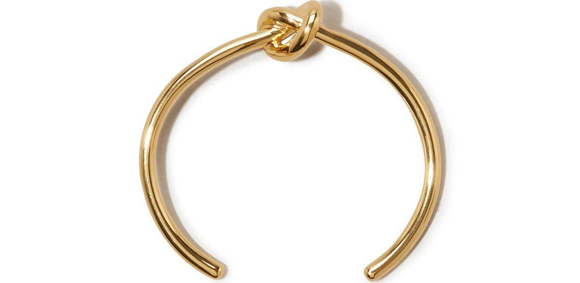Gold love-knot bangle bracelet with a twisted knot centerpiece