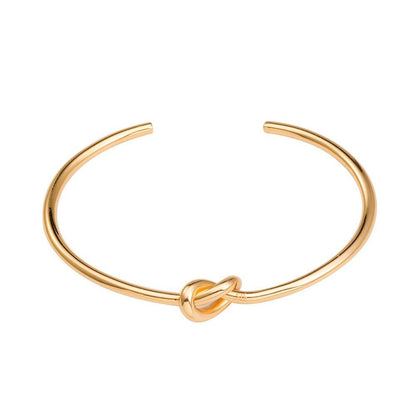 Gold love-knot bangle bracelet with round twist knot detail