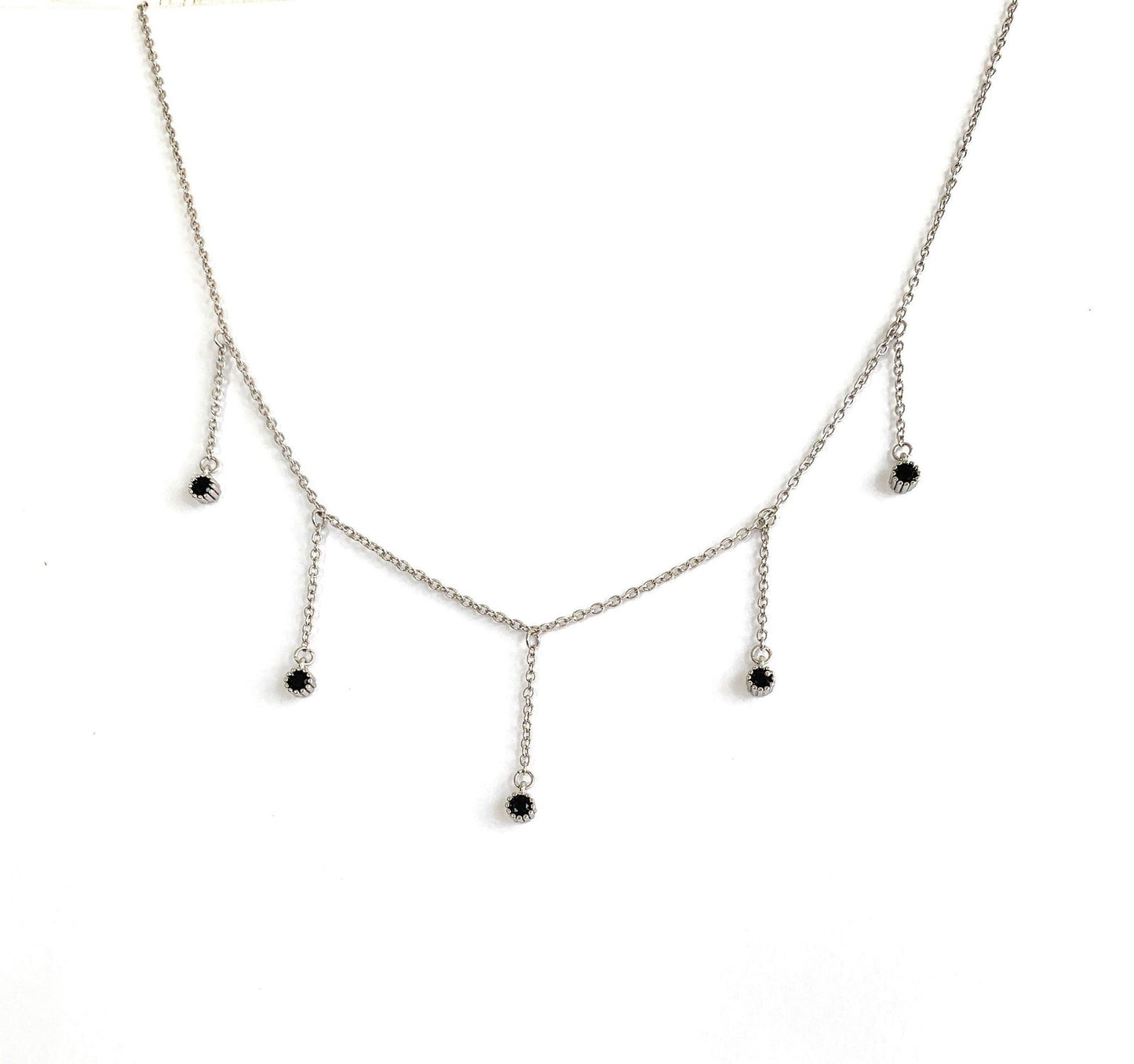 Silver drop necklace with five black cubic zirconia dangle stones