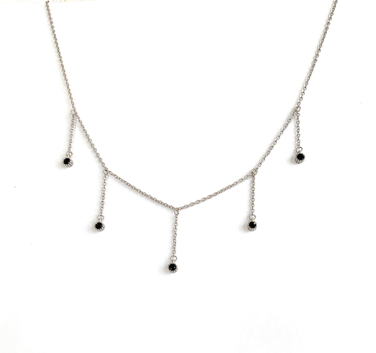 Silver drop necklace with five black cubic zirconia dangle stones