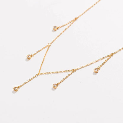 Gold drop necklace with five clear cubic zirconia dangle stones