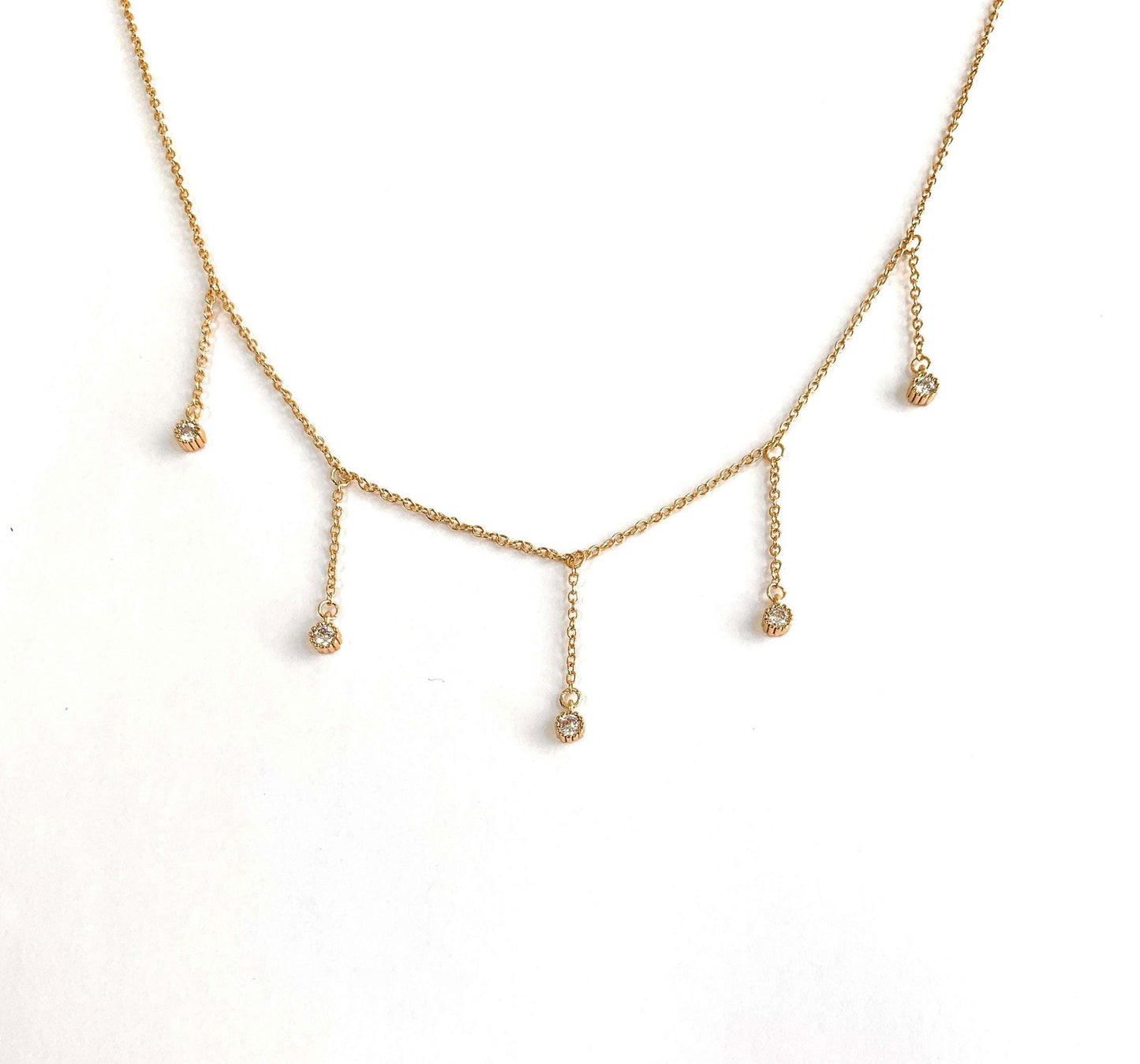 Dainty gold drop necklace with five clear cubic zirconia dangle stones