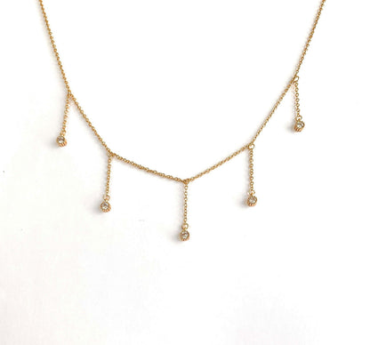 Dainty gold drop necklace with five clear cubic zirconia dangle stones