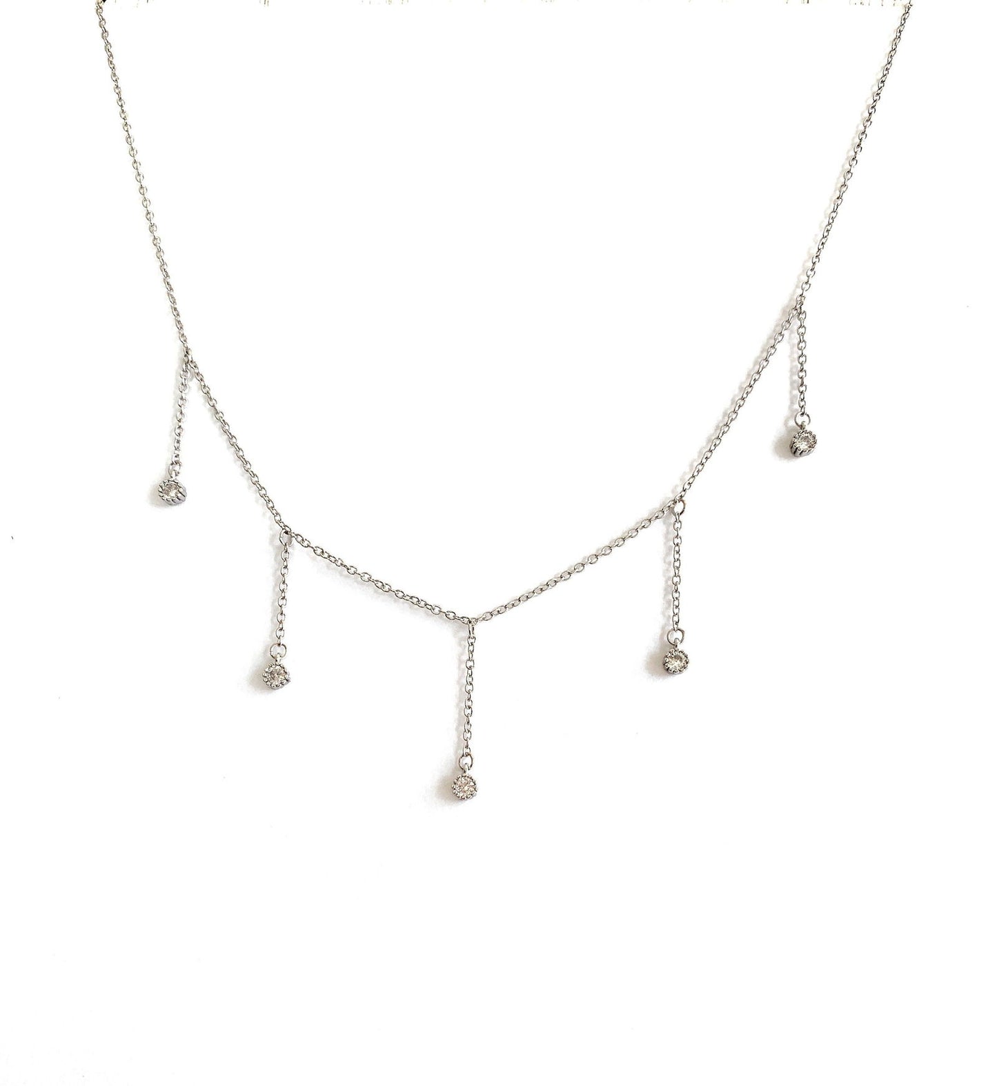 Silver-tone drop necklace with five dangling clear CZ stones