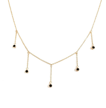 Gold-tone drop necklace with five dangling black CZ stones
