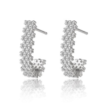 Silver J hoop earrings with sparkling cubic zirconia row and small dangling cluster