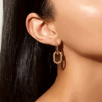Silver link drop earrings with small dangling hoop and chain-textured connector.