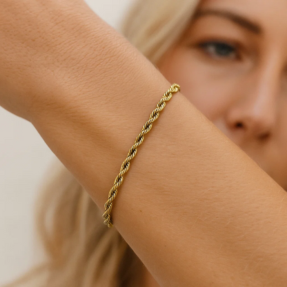 Gold rope chain bracelet close-up on wrist
