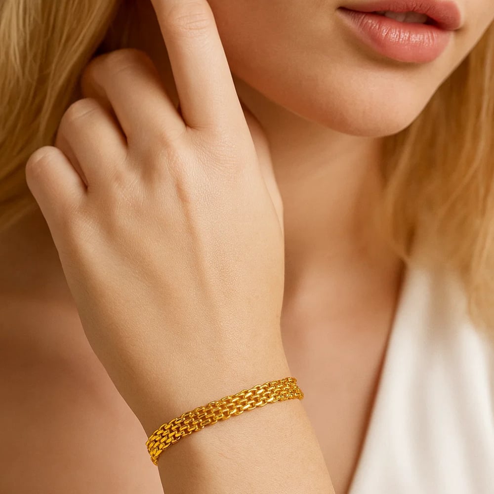 Gold tone adjustable link chain bracelet on wrist