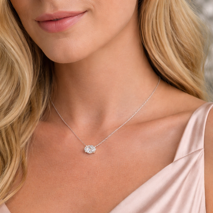 Silver-toned oval-cut solitaire moissanite necklace with bezel-set pendant on fine chain