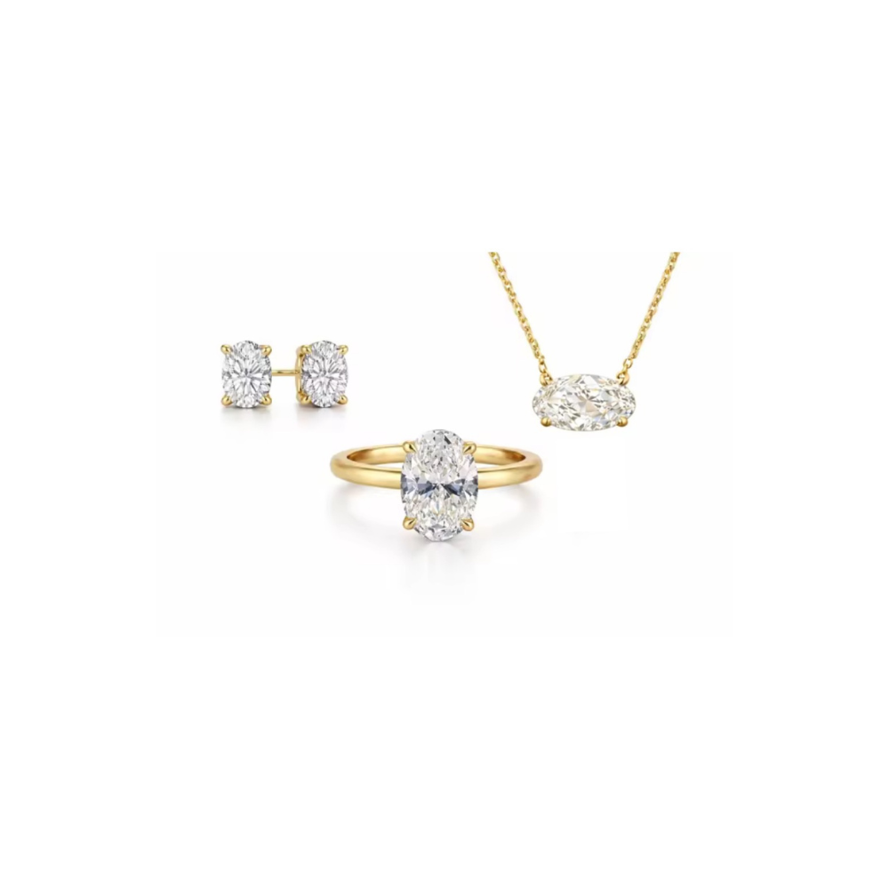 Gold oval-cut solitaire ring with raised four-prong setting
