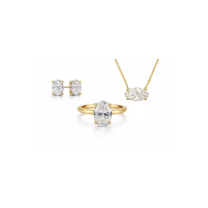 Gold oval-cut solitaire ring with raised four-prong setting