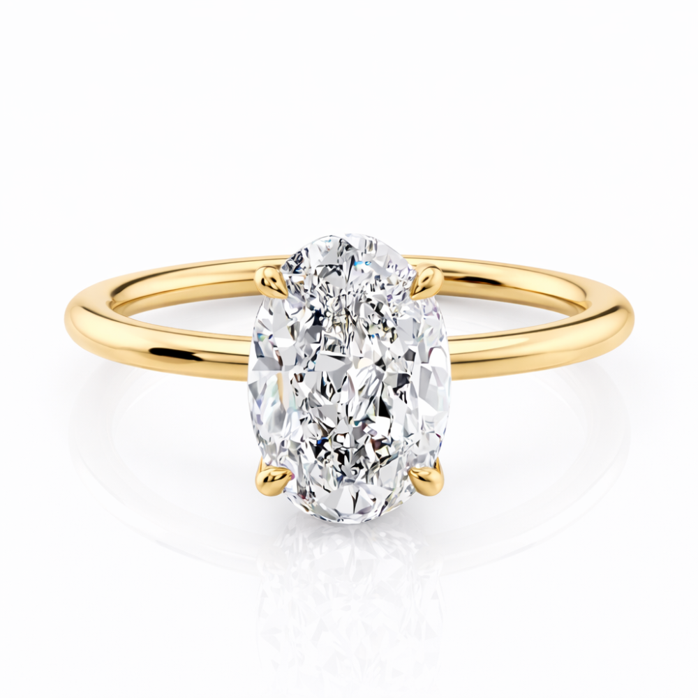 Gold oval-cut solitaire ring with raised four-prong setting