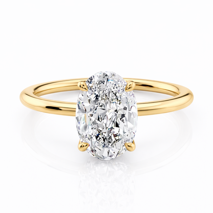 Gold oval-cut solitaire ring with raised four-prong setting