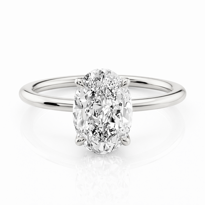 Silver-tone oval cut solitaire ring with four-prong setting and polished band