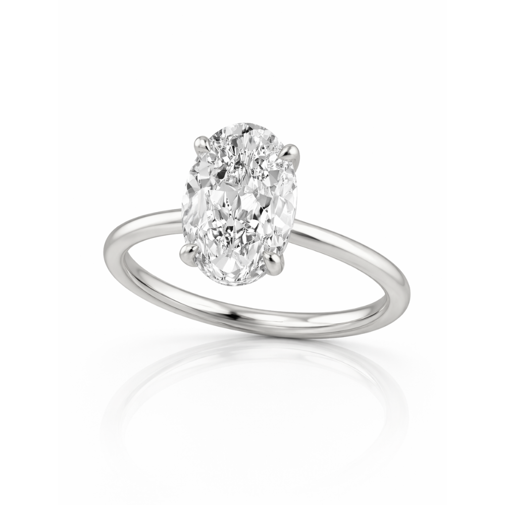 Silver oval-cut solitaire ring with four-prong setting, angled view